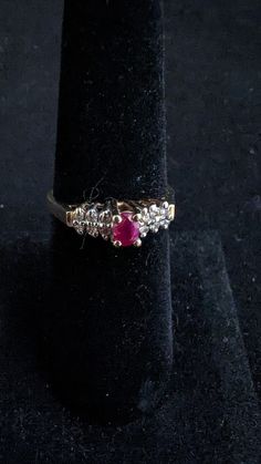 "Vintage Diamond and oval shape Ruby ring marked \"ADL\" and 10K gold. 12 diamonds, 2.35 grams total weight. Size 6 3/4. Good pre-owned condition." Vintage Oval Ruby Ring With Vvs Clarity, Oval Ruby Ring With Diamond Accents For Promise, Oval Diamond Ruby Ring Stamped 14k, Collectible Oval Ruby Ring With Diamonds, Vintage Marquise Cut Rings With Accent Stones, Vintage Marquise Cut Ring With Accent Stones, Oval Ruby Ring With Diamond And 14k Stamp, Oval Ruby Ring With Diamond For Collectors, Oval Ruby Ring With Vs Clarity For Anniversary