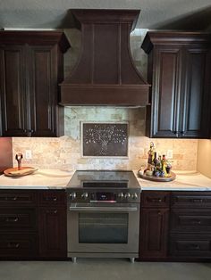 a stove top oven sitting inside of a kitchen next to wooden cabinets and counter tops