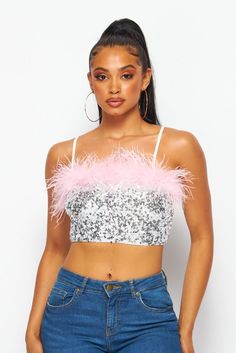 Dazzling sequins and pink feathers pave the way on this spectacular crop that's sure to be a hit from celebrations to nights on the town. • Pink Feather Trim• Adj. Straps• Pull On• Crop• Silver Sequins Sleeveless Feather Trim Party Tops, Fitted Party Tops With Feather Trim, Pink Fitted Crop Top With Sequins, Fitted Pink Crop Top With Sequins, Glamorous Party Top With Feather Trim, Glamorous Feather Trim Top For Night Out, Sequin Crop Top For Club In Spring, Sequined Crop Top For Spring Clubbing, Spring Sequin Crop Top For Club