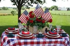 the table is set with red, white and blue plates