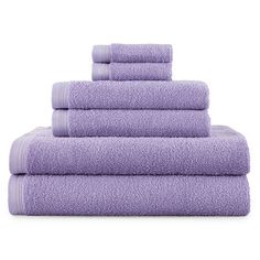 six purple towels stacked on top of each other