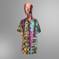 a mannequin's head wearing a colorful t - shirt