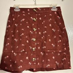 Floral Print American Eagle Corduroy Mini Skirt Trendy Brown Cotton Mini Skirt, Trendy Brown Cotton Skirt, Brown Cotton Mini Skirt With Pockets, Brown Cotton Skirt For Day Out, Cotton Brown Skirt For Day Out, Brown Cotton Skirt With Buttons, Red Mini Skirt With Button Closure, Brown Cotton Mini Skirt, Red Cotton Mini Skirt For Spring