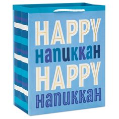 a blue shopping bag with happy hanukkah written on the front and bottom