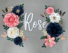 the word rose is surrounded by flowers and butterflies on a gray background with gold accents