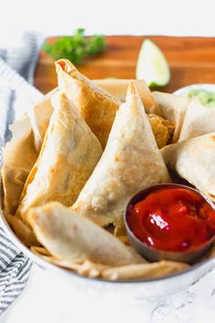 pita chips with ketchup and relish in a bowl on a table