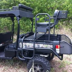 an off road utility vehicle parked in the grass