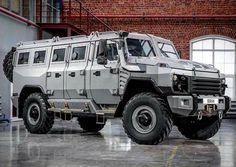 an armored vehicle parked in front of a brick building