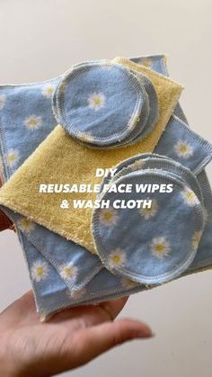 three reusable face wipes and wash cloth in the palm of someone's hand