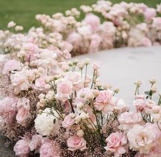 pink and white flowers are arranged in a circle