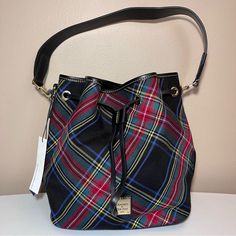 This Cozy Woven Wool Fabric Has A Plaid Pattern That's Both Modern And A Little Bit Nostalgic. Spend The Day In Comfort Carrying This Roomy, Everyday Bucket Bag Thanks To A Thick Leather Strap That Rests Easily On Your Shoulder. Water-Repellent Coated Fabric. Drawstring Closure. Metal-Plated Logo. Detachable Shoulder Strap. Strap Drop Length: 12". 10" X W 7" X L 10" Two Inside Slip Pockets. One Inside Zip Pocket. Cell Phone Pocket. Inside Key Hook. Lined. Four Feet. Step Into Timeless Elegance W Rigid Heddle Weaving Patterns, Drawstring Handbag, Rigid Heddle Weaving, Key Hook, Weaving Patterns, Wool Fabric, Dooney Bourke, Plaid Pattern, Cotton Weaving