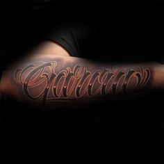 a man with a tattoo on his arm that reads,'california'in cursive writing