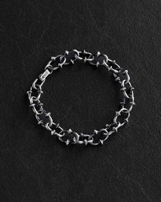 Made from high-quality silver, this exquisite RIKUR bracelet boasts a sleek and stylish design with a width of 1.25 cm. Elevate your accessory game with this elegant piece that combines sophistication with modernity. Perfect for both everyday wear and special occasions, this bracelet is a versatile addition to your collection. Add a touch of luxury to your ensemble with the RIKUR Silver Bracelet. Sizing Guide Please take a moment to measure your wrist before ordering (See photo with how to proce Black Sterling Silver Chain Bracelet, Silver Stainless Steel Bracelets With Hook And Links, Mens Silver Bracelets, Bracelet For Men Silver, Male Bracelets, Mens Chain, Classic Bangles, Mens Chain Bracelet, Chunky Bracelet