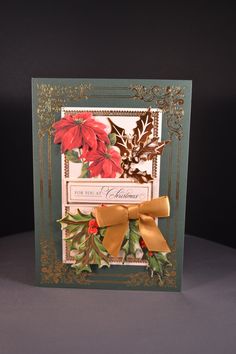 a christmas card with poinsettis and holly