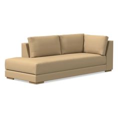 a beige couch sitting on top of a white floor