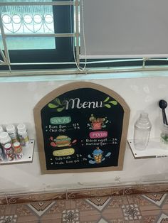 a menu board on the side of a wall with spices and condiments in it