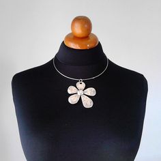 Beautiful minimalist necklace made with a gorgeous flower brass pendant, nickel free. It is a stunning piece, perfect to make everyone's attention turned on you. Choker included ! Contains no lead or nickel. Do not perfume over it or subject it to any liquid substances. I love the pure metal. But over time, metal will darken slightly, but when you rub stationery eraser, brilliance will return. Composition: I always use natural materials, in this case real brass. The materials I use, are made from a small local traditional company. They use natural products such as cotton, silk and viscose and they love colors. The materials are really expensive here compared with them are made in others country but they are ecological, skin friendly, they don't fade and they have very good resistance. Τhei Spring Flower Choker Necklace As Gift, Spring Flower Choker Necklace For Gift, Metal Flower Charm Necklaces, Pendant Flower Necklace As Gift For Her, Spring Choker Jewelry Gift, Spring Gift Choker Jewelry, Metal Jewelry With Flower Charm And Pendant, Metal Flower Necklace For Gift, Minimalist Silver Flower Pendant Necklaces