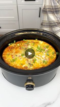 a crock pot with an omelet in it on top of a counter