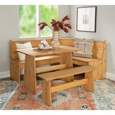 a corner table and bench in a living room