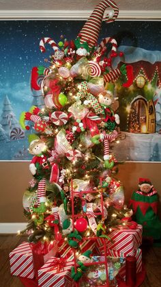 a christmas tree decorated with candy canes and ornaments