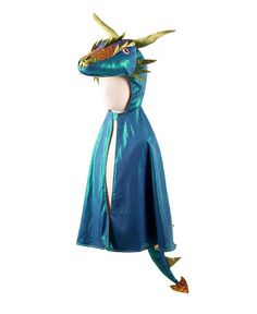 a blue cape with an elaborate dragon head on it's face and tail, attached to a mannequin