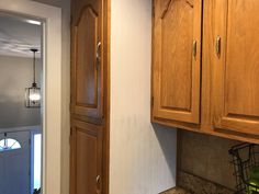 a kitchen with wooden cabinets and granite counter tops