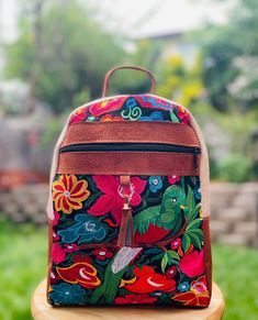 "Beautiful embroidered backpack handmade by Guatemalan artisans.  *Adjustable backpack straps *made in Guatemala *Suede *front and back pocket for smaller items  *For light weight  *dimensions are 12\" by 10\" with bottom width of 3\" Disclaimer: Due to the nature of the product imperfections are expected and appreciated." Embroidered Backpack For Daily Use, Embroidered Shoulder Backpack For Daily Use, Embroidered Shoulder Backpack, Floral Embroidered Backpack For Daily Use, Floral Embroidery Backpack For Everyday Use, Travel Backpack With Floral Embroidery, Floral Embroidery Travel Backpack, Everyday Floral Embroidery Backpack, Embroidered Rectangular Backpack For Daily Use