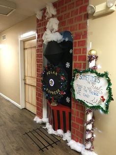 a christmas display with santa's train and snowflakes on the front door