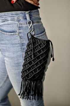 Stylish phone black bag, made in the macrame technique. The bag is fastened with a carabiner to jeans ,trousers and a skirt .You can also carry the bag on you shoulder or chest by tying a drawstring to the bag.In addition a shoelace is attached to the bag. In addition to the bag ,a rope is attached, which is tied to the bag to carry it on your shoulder .A unique and designer bag will emphasize your personality and creativity .Hand wash at 30 degrees, not suitable for dryers . Black Macrame Crochet Bag For Everyday Use, Black Rectangular Macrame Bag, Macrame Phone Bag, Bag Macrame, Small Macrame, Macrame Bag, Dryers, Bag Handmade, Designer Bag