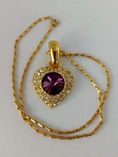 "Gorgeous piece of jewelry. NAPIER stamped unique chain. Gold-tone heart pendant stamped 290. Big diamond cut amethyst glass in the center with white crystals. Length; 16\" Ppendant:1.1/4\" x 1\" Perfect condition. Lovely gift. Thank you for visiting my store. You can also visit my MargaretJewelryShop or http://jewelryandclothing.net/" Vintage Gemstone Heart Pendant Necklace, Vintage Purple Heart-shaped Jewelry, Gold Heart-shaped Jeweled Jewelry, Gold Jeweled Heart Jewelry, Heart-shaped Jeweled Jewelry Gift, Heart-shaped Jeweled Jewelry For Gift, Heart Shaped Jeweled Jewelry For Gift, Gold Heart-shaped Costume Jewelry Necklace, Gold Heart Shaped Costume Jewelry Necklace