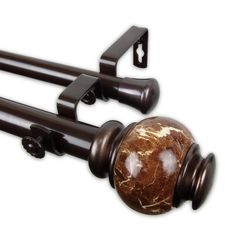 a wooden door handle with a marble ball on it's top and two black handles