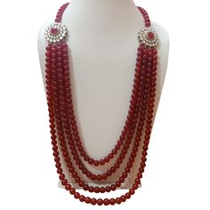 Four layered red pearls necklace for sherwani Red Round Beads Pearl Necklace For Wedding, Red Pearl Necklace For Wedding, Red Pearl Necklace With Round Beads For Wedding, Elegant Red Mala, Elegant Red Mala Beads, Elegant Red Mala With Round Beads, Red Temple Jewelry Bridal Necklace With Polished Beads, Festive Red Pearl Necklace, Festive Red Pearl Necklace With Round Beads