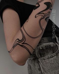 a woman with a tattoo on her arm