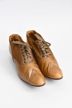 "Antique Edwardian (early) era leather walking shoes. Camel colored leather mixed with canvas. Rounded toe with stitching detail. Wooden heel. Front lace ties. A wonderful representation of attention to detail and lasting craftsmanship. State of garment | very good for age, minimal wear on soles. small repair on left shoe, refer to photos. Measurements ✂--- best fit | Modern 5 1/2 N - 6 N * please refer to measurements below length | 9.5\" width | 2.75\" label | 3 1/2 E ★★Visit The Shop★★ http:/ Vintage Lace-up Boots With Brogue Detailing, Retro Brown Leather Lace-up Shoes, Vintage Brown Lace-up Shoes With Rubber Sole, Vintage Wingtip Leather Shoes For Fall, Retro Leather Lace-up Shoes For Fall, Leather Closed Toe Lace-up Shoes, Vintage Wingtip Lace-up Shoes, Vintage Wingtip Lace-up Shoes For Fall, Vintage Leather Shoes With Rubber Sole For Fall