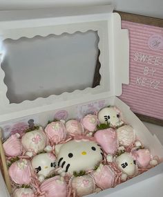 hello kitty chocolates are in a box on the table