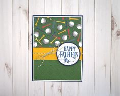 a happy father's day card with golf balls and tees