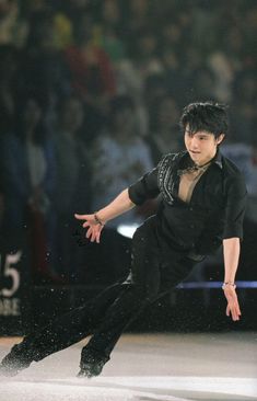 a young man skating on an ice rink