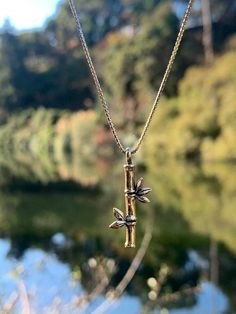 This jointed Bamboo Charm is simple and elegant. The three dimensional charms is 1 1/4" long and is cast in solid 14k gold.In Asian culture, bamboo is a symbol of beauty, harmony, virtue and good luck.Scientifically it is one of the fasted growing growing plants in the world. Bamboo is a grass and there are nearly 1500 species.All Marty Magic Charms and Pendents include an 18 inch (46cm) box chain. If you would prefer a different length of chain please feel free to contact me.This item usually s Opalite Jewelry, Bamboo Necklace, Bamboo Jewelry, Magic Charms, Octopus Necklace, Bamboo Stick, Fish Jewelry, Earrings Golden, Dragon Earrings