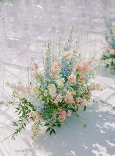 the flowers are on the table ready to be placed in the vases for the guests