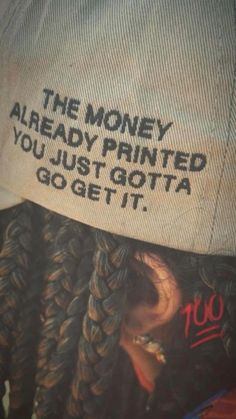 a woman wearing a hat with the words, the money are already printed you just got it