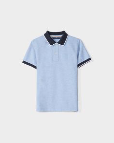 A KIDS WINDCREST PIQUE POLO SHIRT - B0K592C200 in light blue with a color blocked collar and sleeve trim. The dark blue collar features a white stripe on the edge, and the shirt has two buttons at the neckline. A raised-embroidered chest Bunny adorns the left chest area, set against a plain white background by Psycho Bunny. Pique Polo Shirt, Collar And Cuff, Pima Cotton, Style Guides, Mother Of Pearl, Color Block, Polo Shirt, Collar, Blue