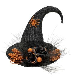 a witches hat with flowers and spider on it