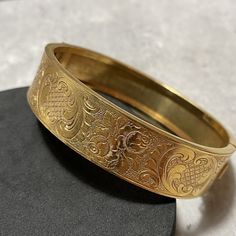 About the item: Bought on my travels to the French brocantes, antiques shops, goodwill stores and flea markets. This item was purchased in Lyon. Gorgeous gold filled/heavy gold plated hinged cuff bangle, signed GDG (Swiss brand), 'plaque or lamine'. 6.5cm diameter, 1.5cm wide. Good vintage used condition. Display box/stand not included. P&P includes postage, packaging and all related costs. Most items are sent tracked and signed for, where available/appropriate. Vintage Gold Plated Bracelets, Vintage Gold Bracelet Bangles, Affordable Vintage Gift Bangle, Affordable Vintage Gold Bangle, Luxury Vintage Gold-tone Bracelets, Luxury Engraved Ornate Bangle, Antique Gold Cuff Bracelet Collectible, Vintage Ceremonial Jewelry With Historical Design, Antique Gold Cuff Bracelet For Formal Occasions