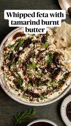 a plate with hummus, pita bread and other food items on it that says whipped feta with tamarind burrito butter