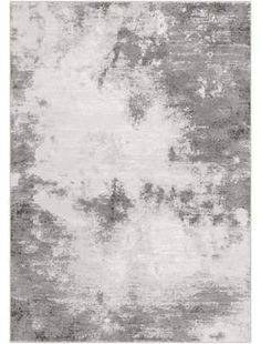 a gray and white rug with an abstract design