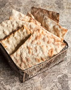 some crackers are sitting in a basket on the table