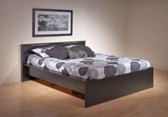 the bed is made up and ready for someone to use it in their home or office