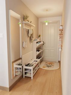 the hallway is clean and ready to be used as a storage area for shoes or other items