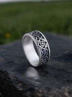 Embrace the spirit of the Valkyrie with this Norse Mythology Ring featuring an intricate Celtic knot pattern. Symbolizing strength, courage, and connection, this ring is inspired by the legendary warrior maidens of Norse lore. The Celtic knot design adds a touch of elegance while representing unity and eternity. Ideal for lovers of Nordic and Celtic heritage, this ring makes a meaningful gift or a unique addition to your jewelry collection. Product Details: Material: 925 Sterling Silver Weight: Symbolic Intricate Design Promise Ring, Symbolic Promise Ring With Intricate Design, Symbolic Engraved Ring With Intricate Design, Symbolic Ring With Intricate Design For Promise, Symbolic Engraved Wide Band Ring, Norse Valkyrie, Slavic Men, Nordic Mythology, Mythology Jewelry