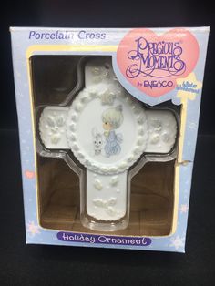 the porcelain cross is in its box